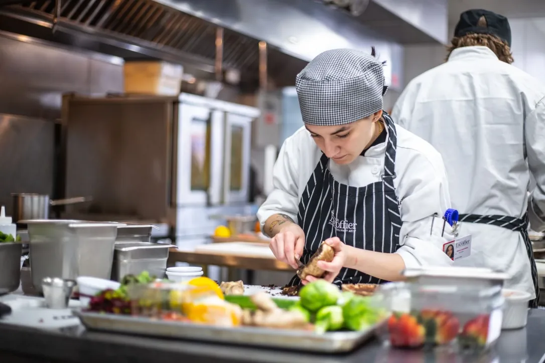 Culinary professional preparing food in a commercial kitchen