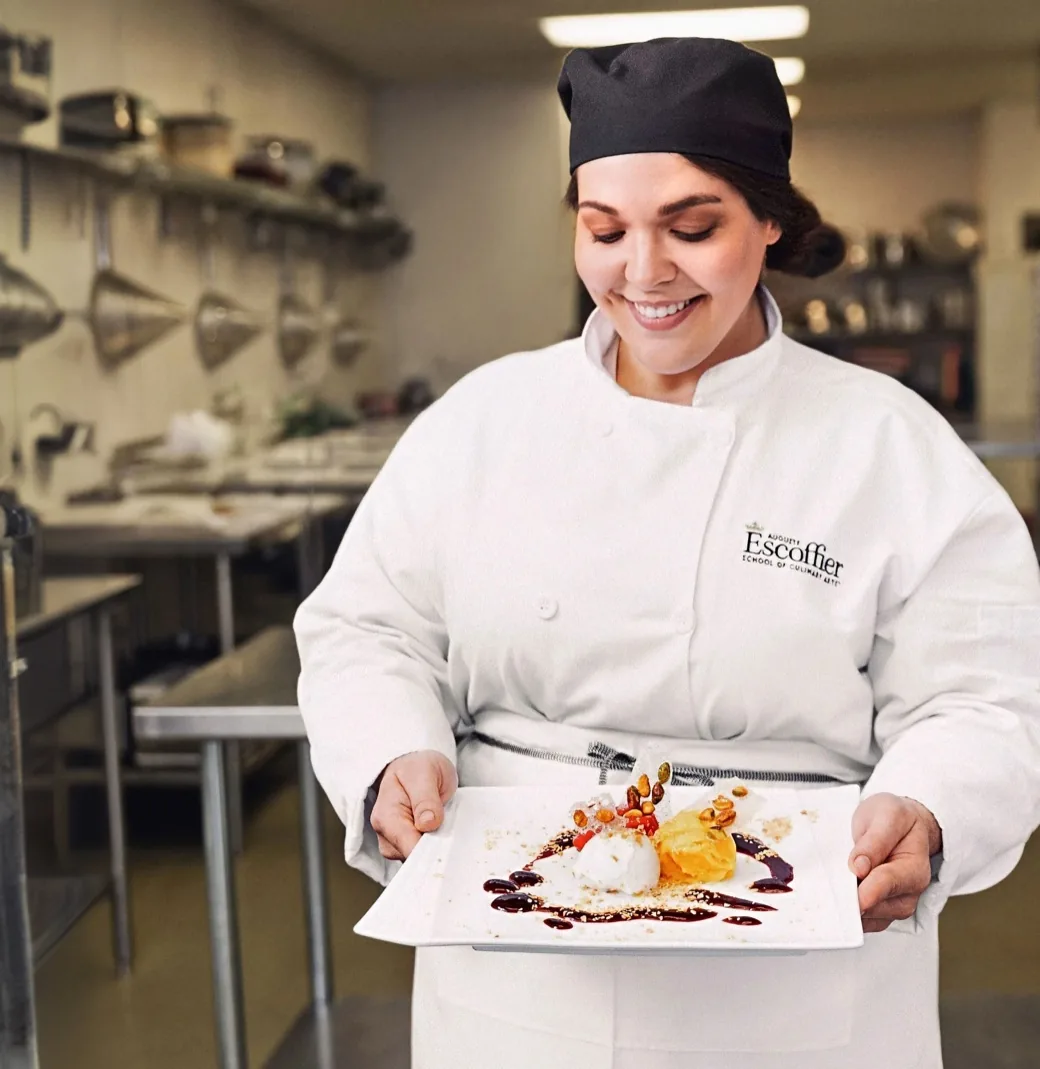 Culinary professional plating a dish